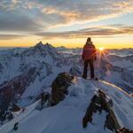 A Man Standing on the Top of a Amountain