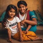 A Boy Name with Meher on His White Tshirt in Black Letters and a Girl Sits Side to Him and Wears a Sari of Colour Black and Having a Pussy in Hand