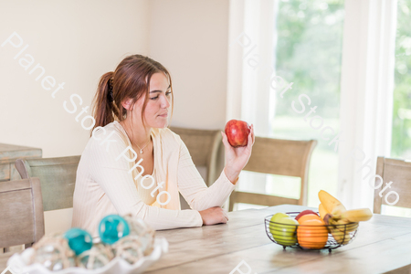 A young lady grabbing fruit stock photo with image ID: 6f2331e5-7a48-4681-b1e6-3106a22129f1