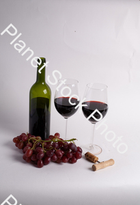 One bottle of red wine, with wine glasses, corkscrew, and grapes stock photo with image ID: b56f8aaa-e4be-4a28-9218-ffc1a1f18d76