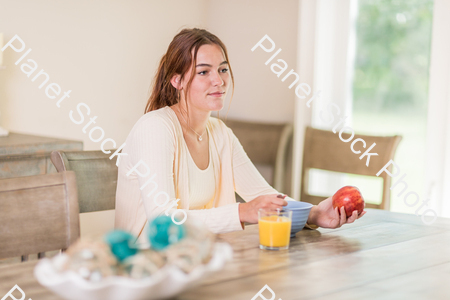 A young lady having a healthy breakfast stock photo with image ID: 19496046-f43c-4ea0-898c-0102daec7b67