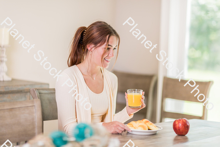 A young lady having a healthy breakfast stock photo with image ID: 50db03c3-9851-4efc-ba3d-3b81bbf0d900