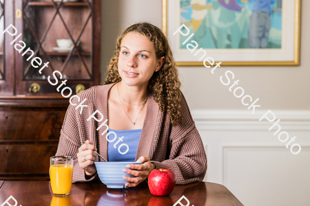 A young lady having a healthy breakfast stock photo with image ID: 192ac48b-8a68-42f4-a865-7655b8f170b6
