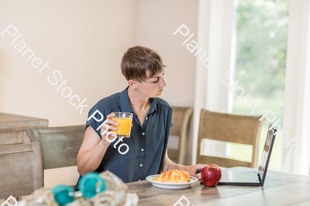 A young lady having a healthy breakfast stock photo with image ID: 92f8e775-2a32-4782-a674-09eea26519d9