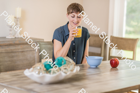 A young lady having a healthy breakfast stock photo with image ID: 3366d9fb-127a-475f-919a-d2810e502ca7