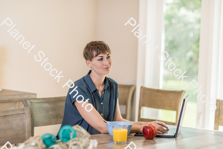 A young lady having a healthy breakfast stock photo with image ID: f9a628b3-85e8-4c11-a22a-850b0b0fe527