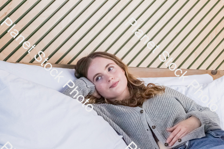 A girl lying in bed stock photo with image ID: 1b5187a3-741a-43e2-8263-fe3802de5a34