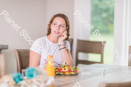 A young lady having a healthy meal stock photo with image ID: 22cb3684-b57a-471e-9c85-04109805488e