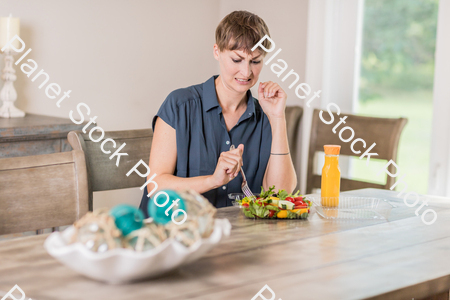 A young lady having a healthy meal stock photo with image ID: 579c15cc-10db-4f07-941c-2d7f7ec6ba5b