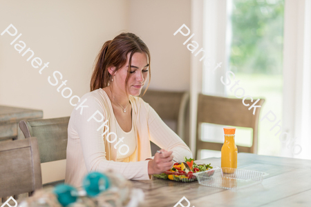 A young lady having a healthy meal stock photo with image ID: 18815bef-c0cc-41a6-958f-3a05b8130096