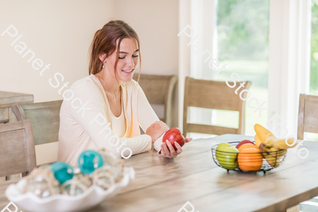 A young lady grabbing fruit stock photo with image ID: df7d3d17-e944-4d21-9fdc-4712073b1498