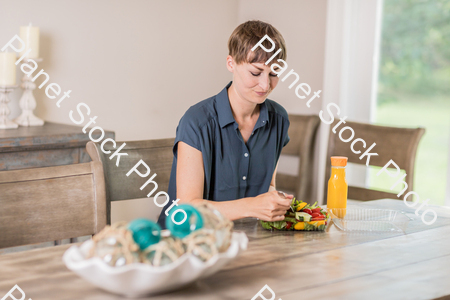 A young lady having a healthy meal stock photo with image ID: 7a6c5949-4d84-42d9-a526-953d562d6fc0