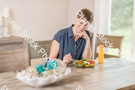 A young lady having a healthy meal stock photo with image ID: e604f20a-28d0-4460-9a4d-9cf2ae6b7b73