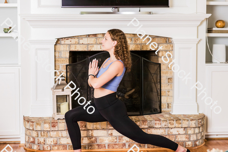 A young lady working out at home stock photo with image ID: a85a129e-859f-4fa0-bf04-00306f4217df
