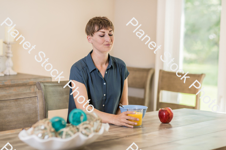 A young lady having a healthy breakfast stock photo with image ID: f7f4623b-83e5-46de-9972-acef69bfb6f8