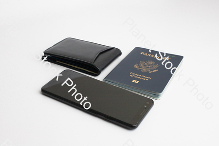 A mobile phone, with a black leather wallet, and US passport stock photo with image ID: f1811d90-90c7-4196-83c8-3e4aad6857b2