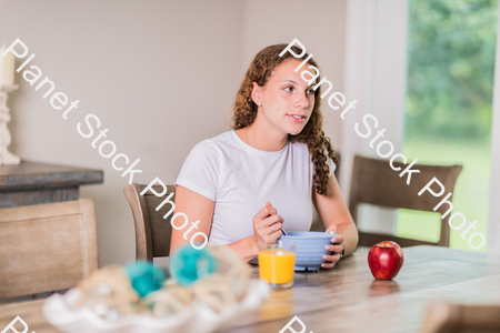 A young lady having a healthy breakfast stock photo with image ID: 914b11d7-4e68-4e7e-9e4c-859450e53bb7