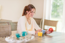 A young lady having a healthy breakfast