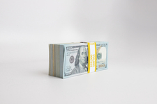 Three stacks of dollar-bills
