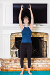 A young lady working out at home