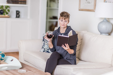 A young lady sitting on the couch