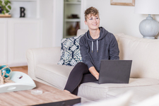 A young lady sitting on the couch