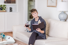 A young lady sitting on the couch