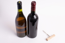 Two bottles of wine, with corkscrew